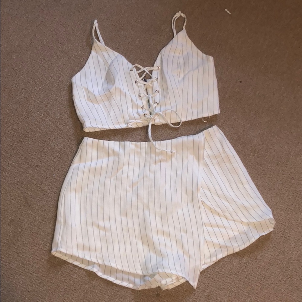 Two piece white pinstripe crop tank and skort